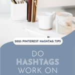 A minimalist desk with books, pens, and mugs beside a computer screen. Text overlay asks, "Do hashtags work on Pinterest?" with a calm tone.