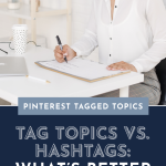 A woman sits at a desk writing on paper with a pen, in a white, bright office space. Text reads: "Pinterest Tagged Topics: Tag Topics vs. Hashtags: What's Better on Pinterest?"
